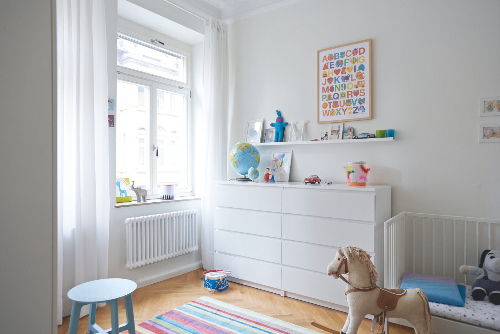[Translate to Francais:] [Translate to Nederlands:] Een witte designradiator in de kinderkamer.